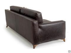 Rear view of the Elwood sofa highlighting the formal rigour of the structure that accommodates soft cushions