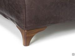 Detail of the foot moulding in walnut-stained beech