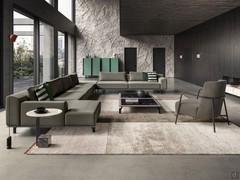 Cassis sofa offered here in a corner composition ending with a chaise longue on one side and matching side tables