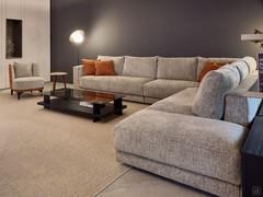 Detail of the Clive sofa proposed here in a large corner composition with pouf at the side