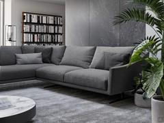 Generous and enveloping shapes, enhanced by the coarse-weave fabric in dark tones