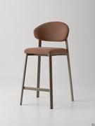 Omnia stool in upholstered version with curved backrest, also available with two-tone upholstery