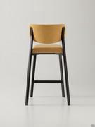 Rear view of the Omnia stool in the upholstered version with plain backrest