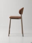 Side view of the Omnia stool in the upholstered version with curved backrest