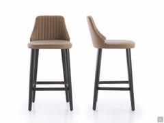 Front and side view of the Neva stool in the kitchen counter version with seat h.65 cm