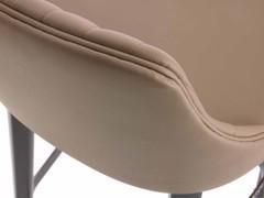 Detail of the workmanship of the leather cover on the upholstered shell of the Neva stool