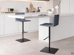 The adjustable upholstered stool Fast is available with different bases and multiple covers and colors