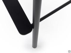 Close up of the structure with matte black painted metal footrest