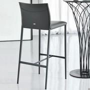 Norma by Cattelan upholstered stool with metallic legs matched to Nido Bistrot table