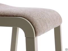 Bryanna backless high stool with seat upholstered in textured fabric