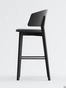 Lateral view of the Darcey barstool, showing its harmonious proportions and curved, welcoming backrest