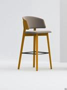 Darcey barstool with a structure and outer backrest in stained beech wood, paired with contrasting fabric upholstery