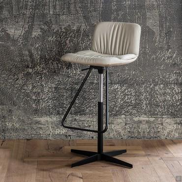 Axel is a stool by Cattelan with a central spoke or square base