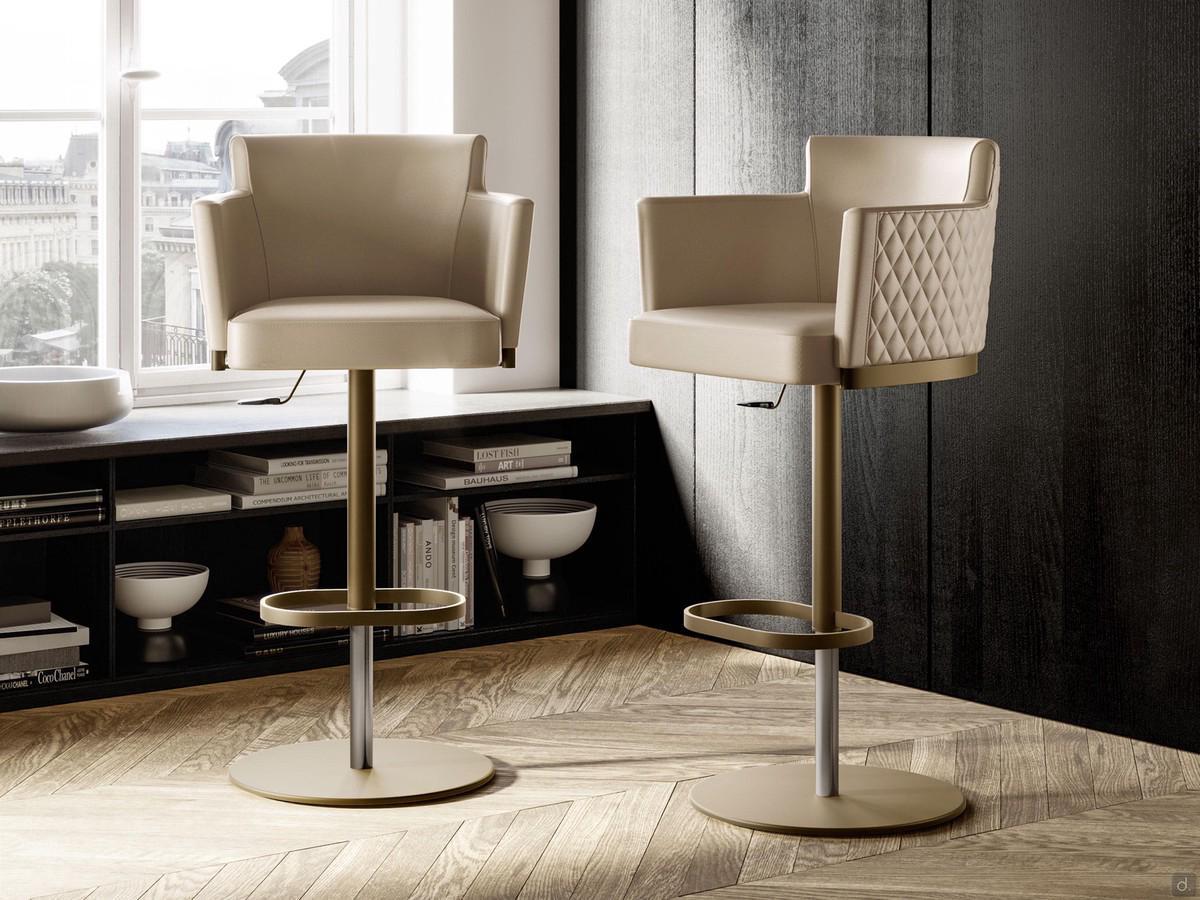 Evora upholstered swivel stool with armrests, here in the elegant version with quilted backrest