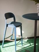 Minima coloured wooden stool with upholstered seat