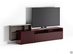 California low TV cabinet with matte lacquered frame and open wooden element. 65-inch TV on 240 cm wide cabinet.