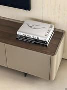 Detail of the top in Canaletto walnut combined with the structure and doors in smooth leather