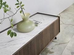 Detail of matte ceramic stone top Statuarietto with perimeter structure, shell and fronts made of wood