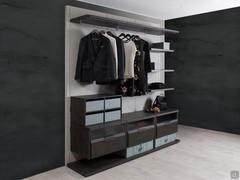 Bliss Player boiserie walk-in closet with Piasentina stone-effect melamine panels