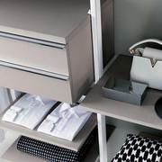 Detail of the shelf and the suspended chest of drawers with two drawers of the walk-in wardrobe Byron