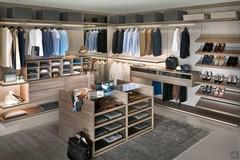 Bespoke corner walk-in wardrobe with a range of internal equipment