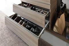 Capacious shoe rack with moulded sheet in matt lacquer metal titanium