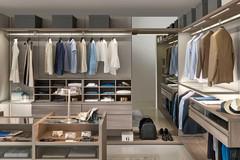 Wooden and glass shelves with LED lighting, clothes rails, shirt cubbies and suspended drawers