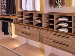 Drawer cabinets and shirt racks in natural walnut veneer on nude matt lacquered backs and sides