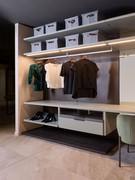 Bliss Player walk-in wardrobe with panelling, equipped with shelves, shoe racks, drawers and hanging tubes