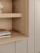 Detail of living area with shelves in open-pore oak wood E11 Light