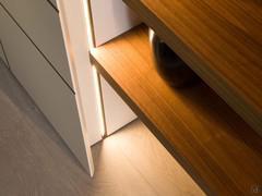 Lounge column cupboard with lateral LED strips and internal shelves