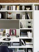 View of bookcase with drop-down door for desk use