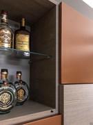 One compartment of the wall unit can be used as a bar cabinet for bottles, glasses and wine glasses. Ash oak finish not available