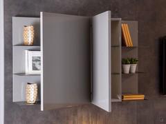 The eye-catching "book" opening of the doors of the wall unit give symmetry to the Plan 39 wall without compromising functionality