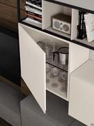 View of the matching lacquered interior on the exterior of a cube wall unit with Freehand door