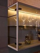 The sides of the display case are also made of glass, matching the doors and the inside shelf