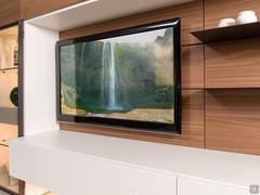 Way 28 wall system with wooden doors, suitable for either a suspended TV or one resting on drawer bases