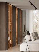 Alternating Lounge Patchwork bookcases and Lounge wardrobe columns. All elements of the Lounge collection are, as in this case, freely combinable with each other to create large compositions in the living room or bedroom