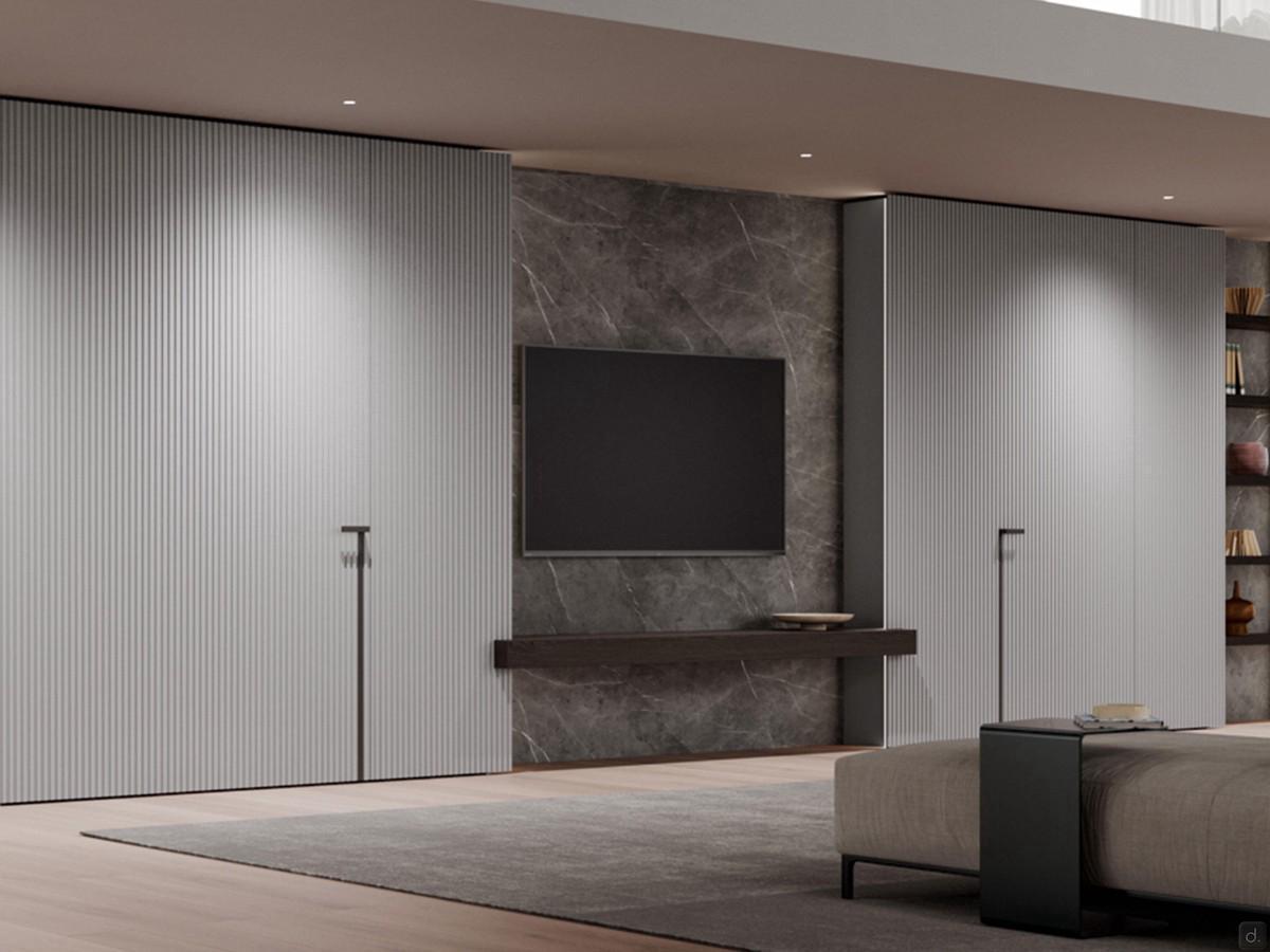 TV boiserie with integrated lighting Lounge: the wall backs are made of Laminam pietra grey ceramic stone.