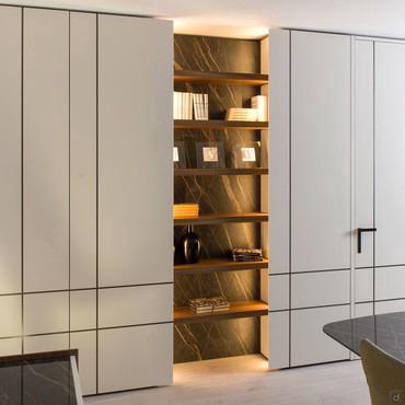 Lounge bookcase with wall panelling and shelves