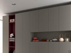 Wide matt lacquered hinged wall units for the living room. Also available in wood veneer, veneered or with mirror door. The type of opening includes either a concealed groove or a painted or lacquered metal groove