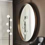 Miroir rond Wish de Cattelan en métal verni brushed bronze