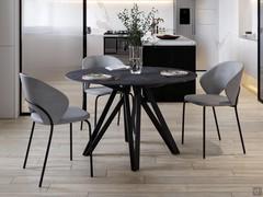 Table Station configurée avec des tons sombres, associée à fauteuils rembourrés