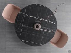 Table à manger ronde extensible avec plateau en HPL stratifié. De nombreuses finitions de stratifiés rappellent les veines du marbre et de la pierre naturelle.
