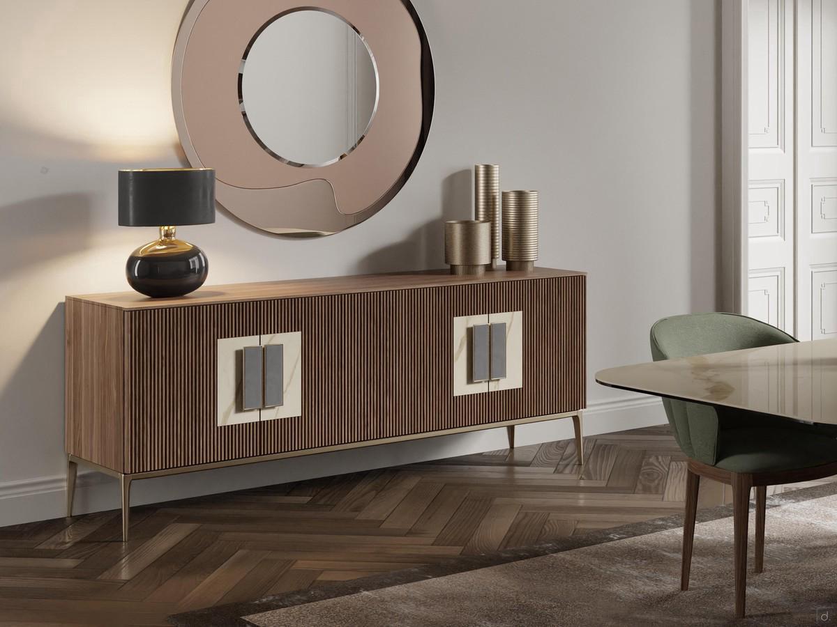 Credenza Window con ante in legno listellare nella variante noce canaletto: un classico impiego in soggiorno in abbinamento all'importante specchio circolare Rising