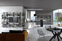 Perfetta anche in open space la cucina con penisola crea una divisione tra area operativa e area living