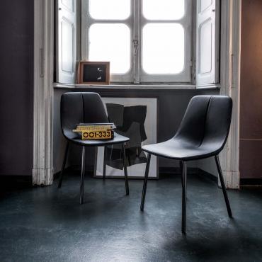 By chair by Bonaldo with chromed sled base and 4 Black Nichel chromed legs