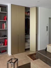 Built-in entryway wardrobe with floor-to-ceiling doors