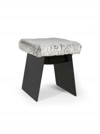 The Calvin pouffe stool with an open metal structure and seat cushion upholstered in synthetic fur (extra, not in the sample book)