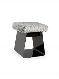 The Calvin pouffe stool with a closed metal structure and seat cushion upholstered in synthetic fur (extra, not in the sample book)